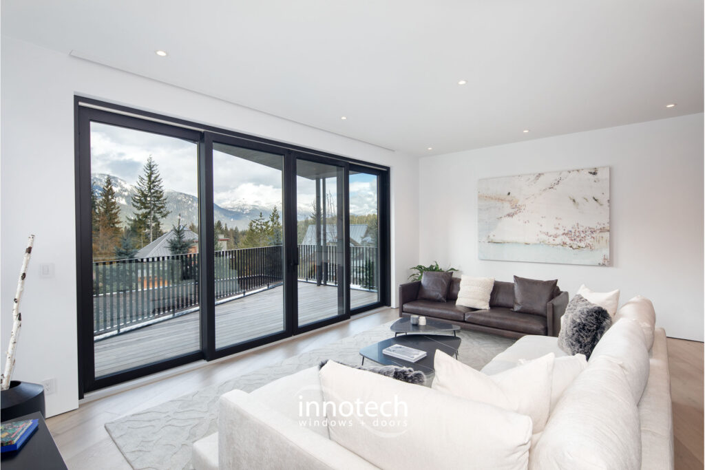 black lift and slide door in a white living room