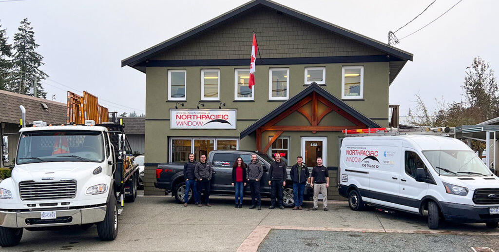 North Pacific Window team in front of their office/showroom with service van and delivery truck